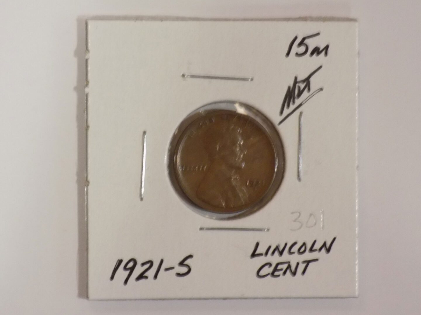 A 1921 lincoln cent in a box.