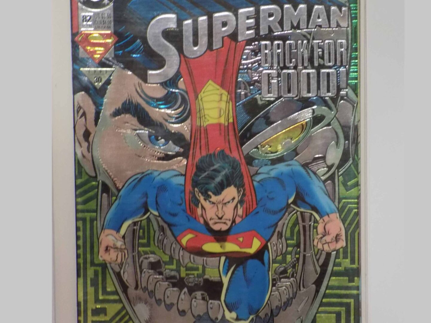 A comic book cover with superman on the cover.