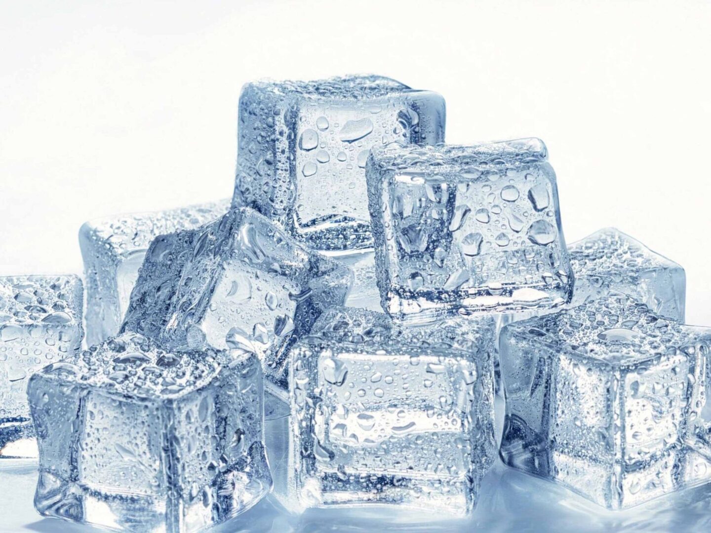 A pile of ice cubes on a white background.