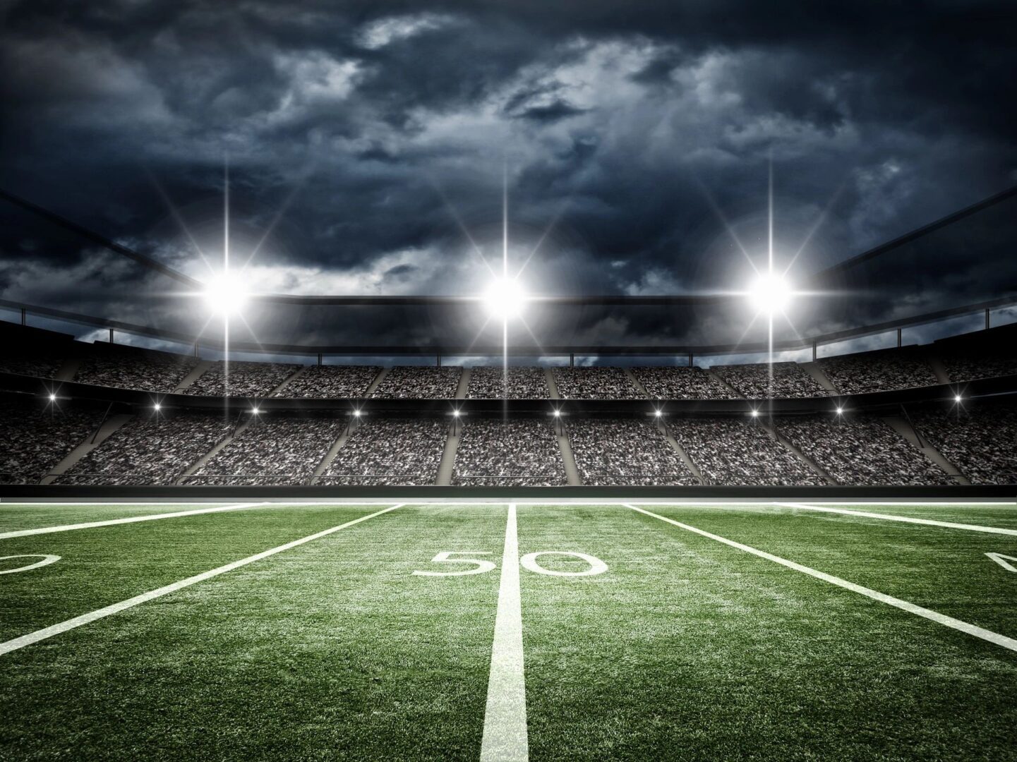 An american football stadium at night.