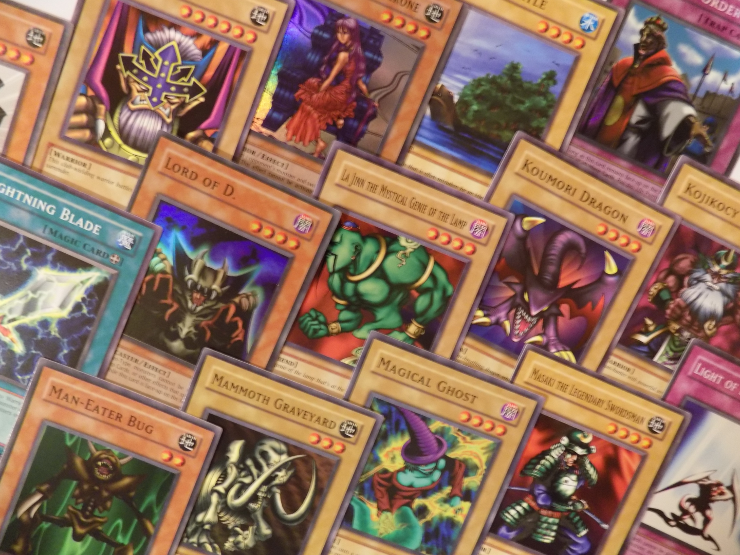 A collection of yu-gi-oh cards.