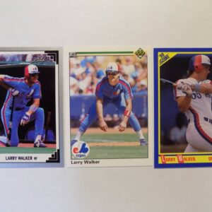 Three Walker, Larry baseball cards are shown on a white surface.