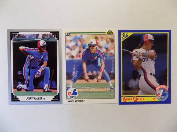 Three Walker, Larry baseball cards are shown on a white surface.