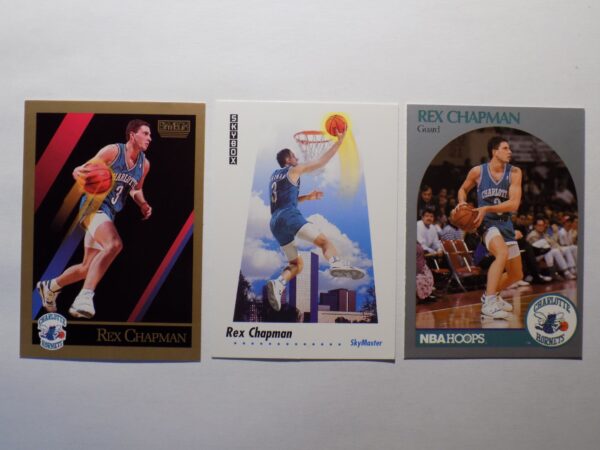 Three Chapman, Rex basketball cards are shown on a white surface.