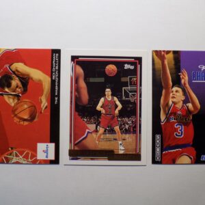 Three Chapman, Rex basketball cards with different players on them.