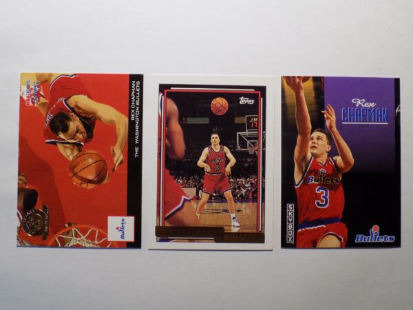 Three Chapman, Rex basketball cards with different players on them.