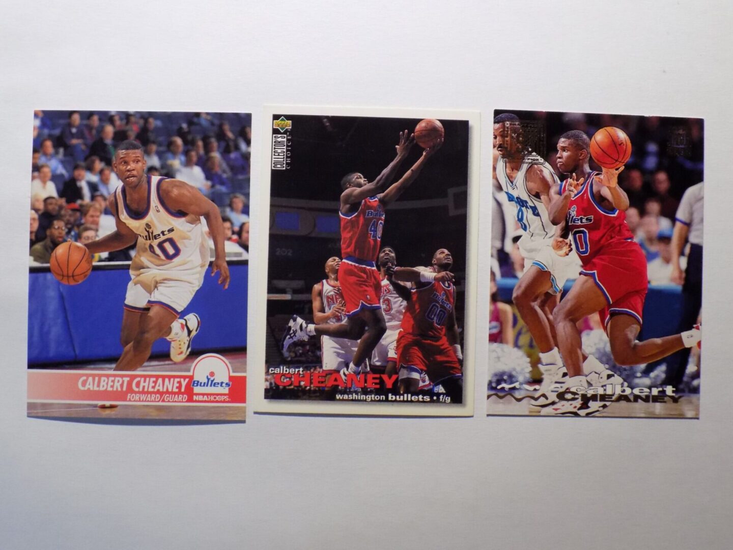 A set of Cheaney, Calbert basketball cards with different players on them.