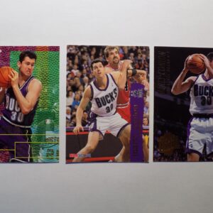 Three Conlon, Marty basketball cards with different players on them.