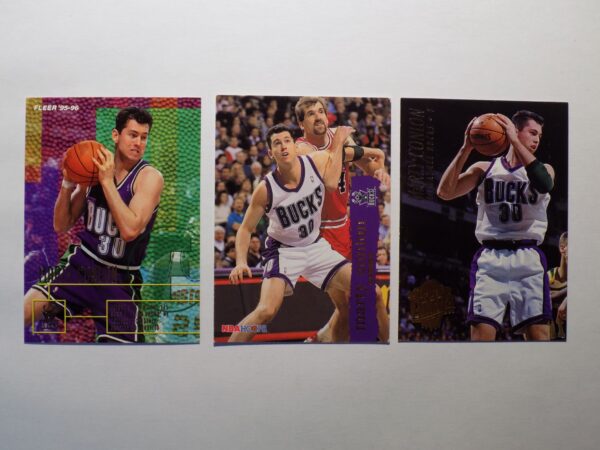 Three Conlon, Marty basketball cards with different players on them.