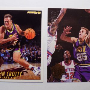 A pair of basketball cards with a picture of John Crotty.