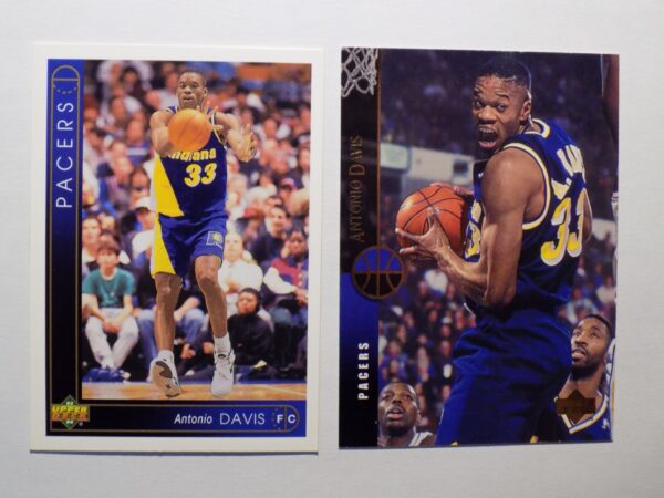 A pair of Antonio Davis basketball cards with a man playing basketball.