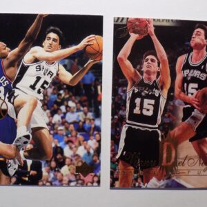 A pair of Del Negro, Vinnie basketball cards with two players on them.