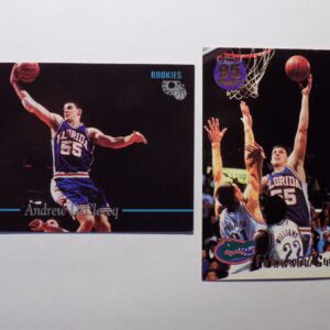 A pair of DeClercq, Andrew basketball cards with a player in the air.