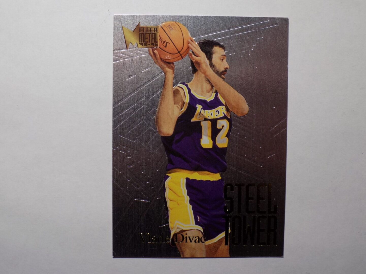 A Divac, Vlade card with an image of a player holding a basketball.