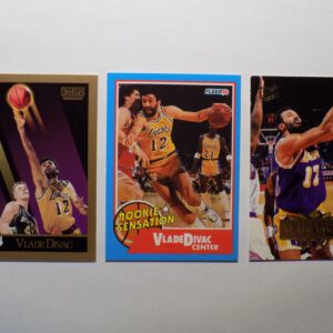 Three basketball cards with a picture of Divac, Vlade.