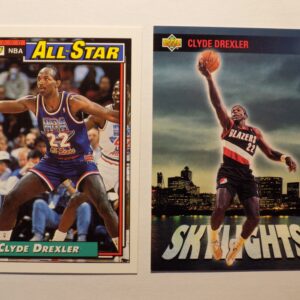 Two basketball cards with Clyde Drexler on them.