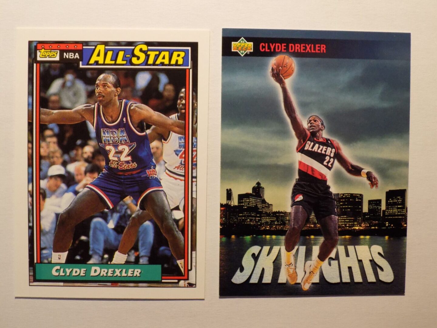 Two basketball cards with Clyde Drexler on them.