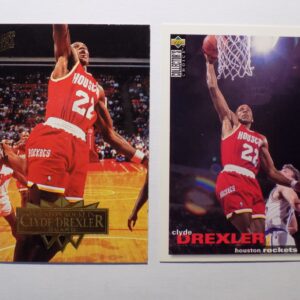 A pair of Drexler, Clyde basketball cards with a basketball player in the middle.