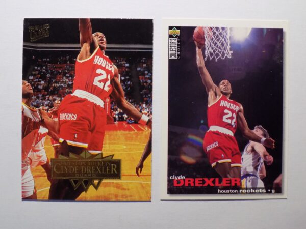 A pair of Drexler, Clyde basketball cards with a basketball player in the middle.