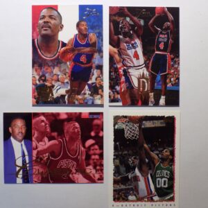 Four Dumars, Joe basketball cards with autographs on them.