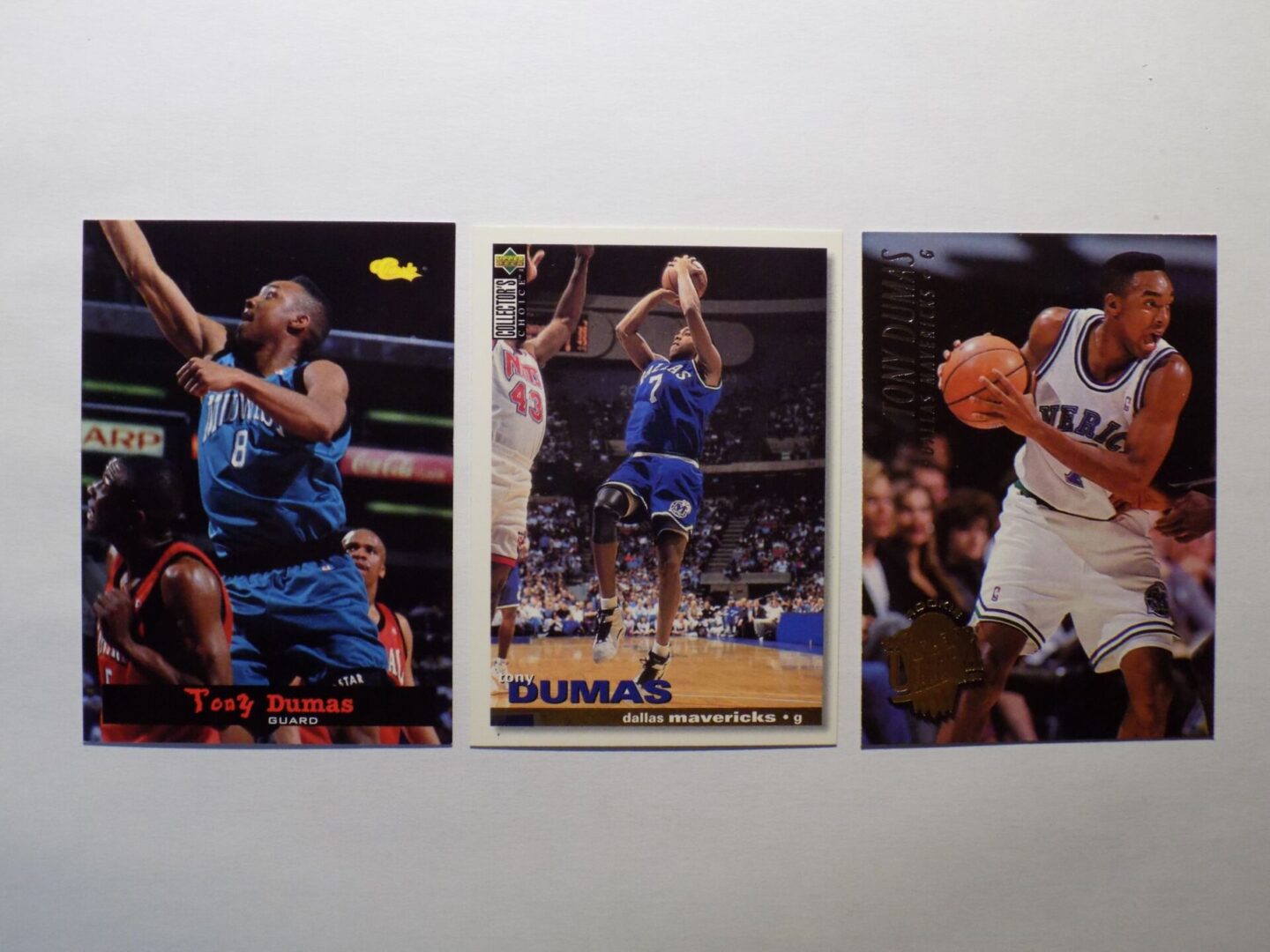 Three Dumas, Tony basketball cards with different players on them.