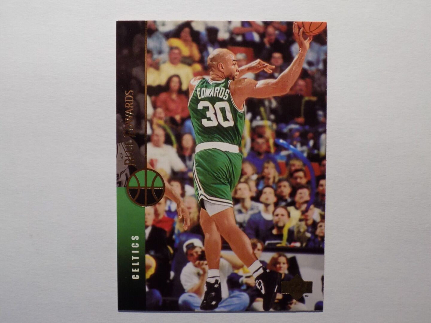 A basketball card with Edwards, Blue in a green uniform.