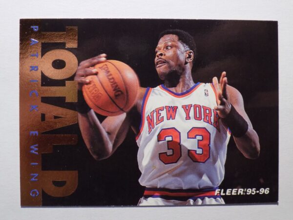 A basketball card with Patrick Ewing holding a ball.