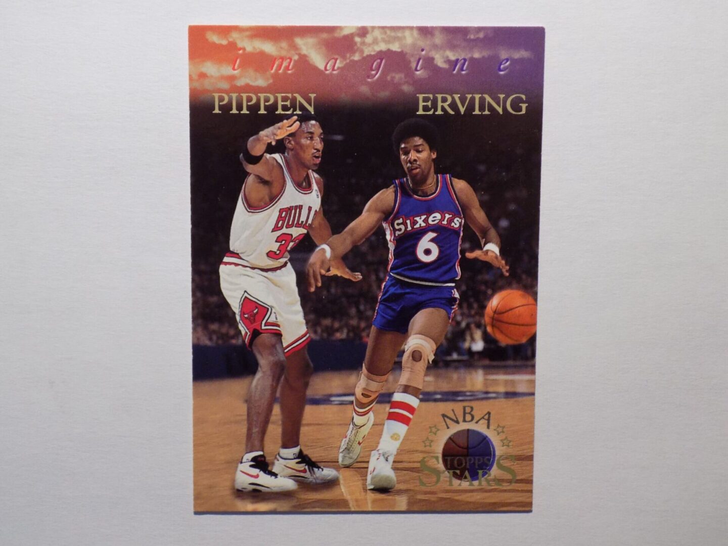 A Erving, Julius card with two men playing basketball.