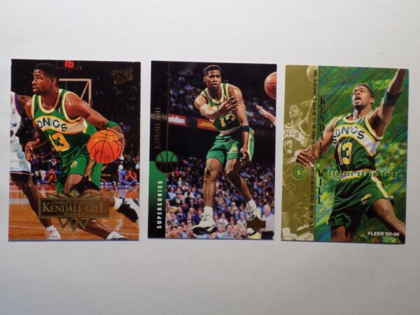 A set of Gill, Kendall basketball cards with three players on them.