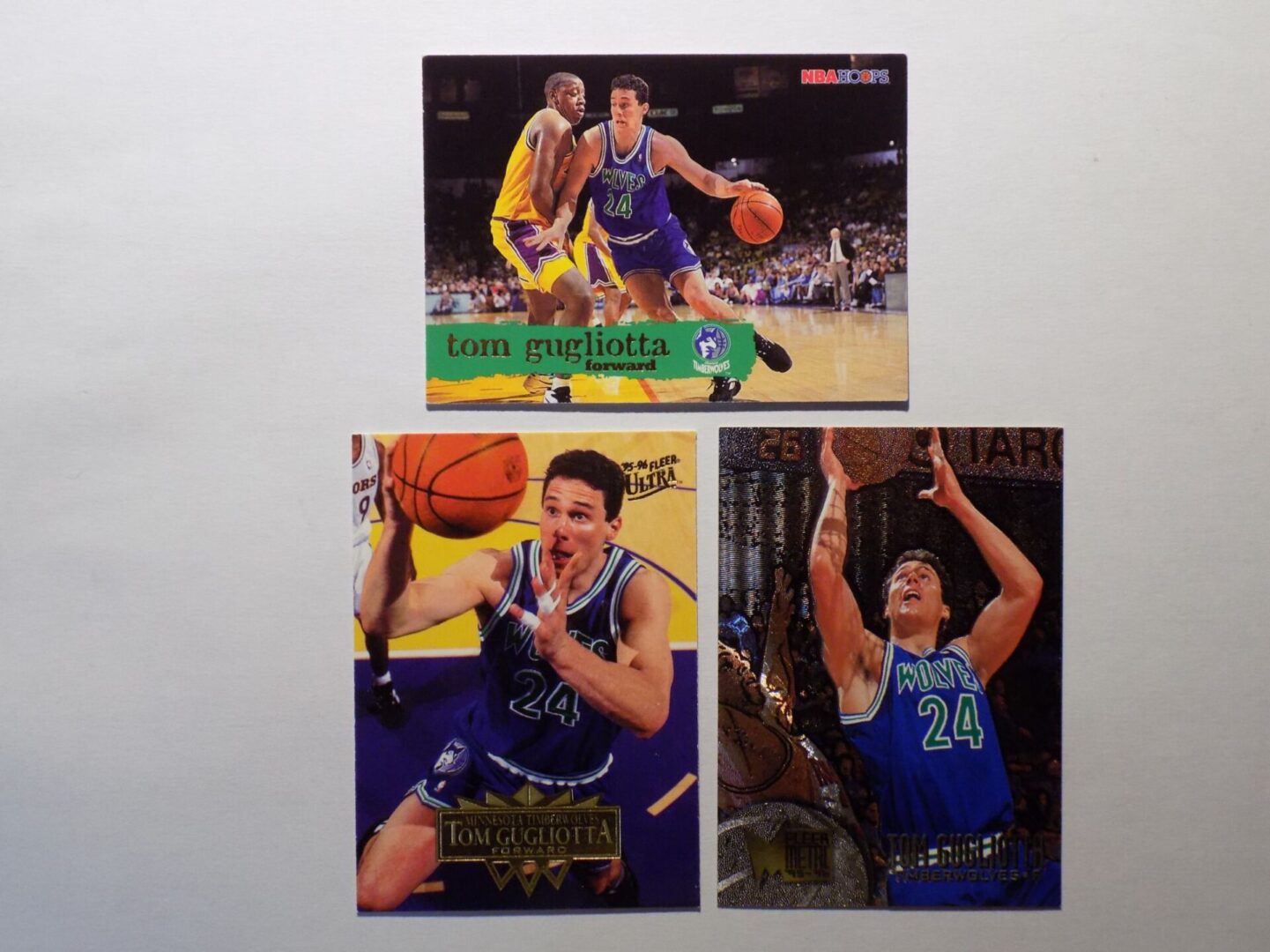 Three Gugliotta, Tom basketball cards with different players on them.