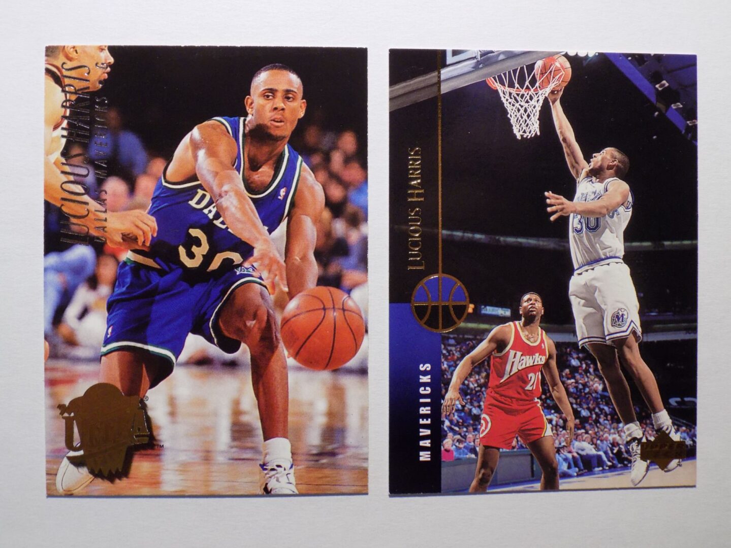 A pair of Harris, Lucious basketball cards with a player in the air.