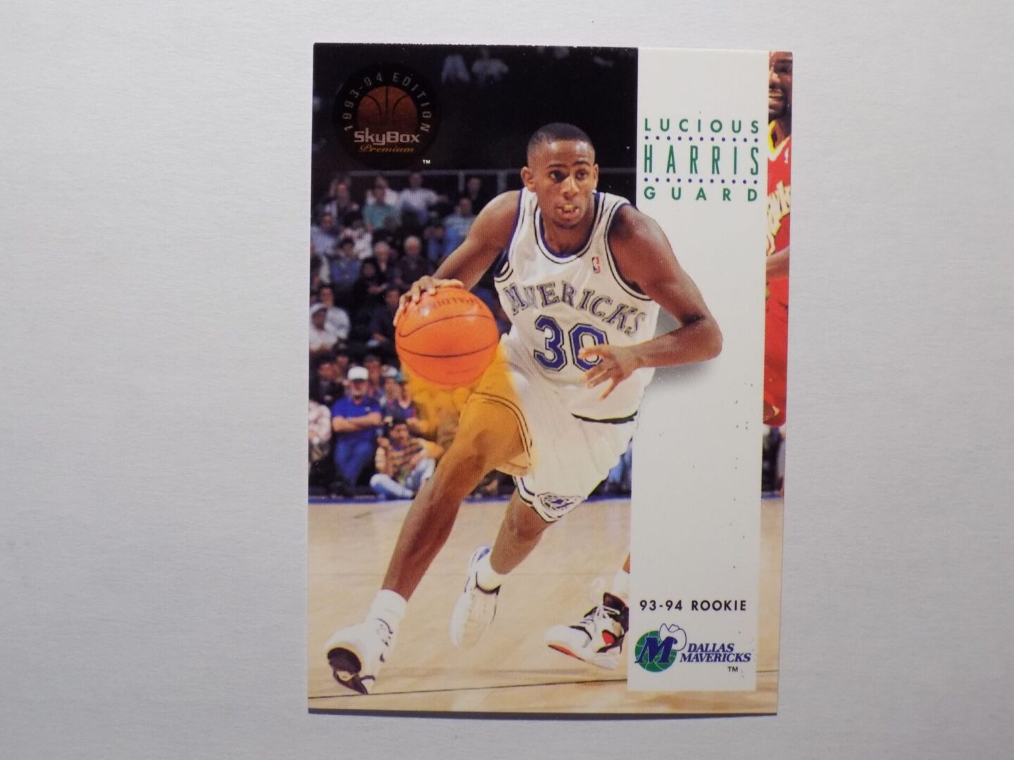 A Lucious Harris basketball card with a man playing basketball.