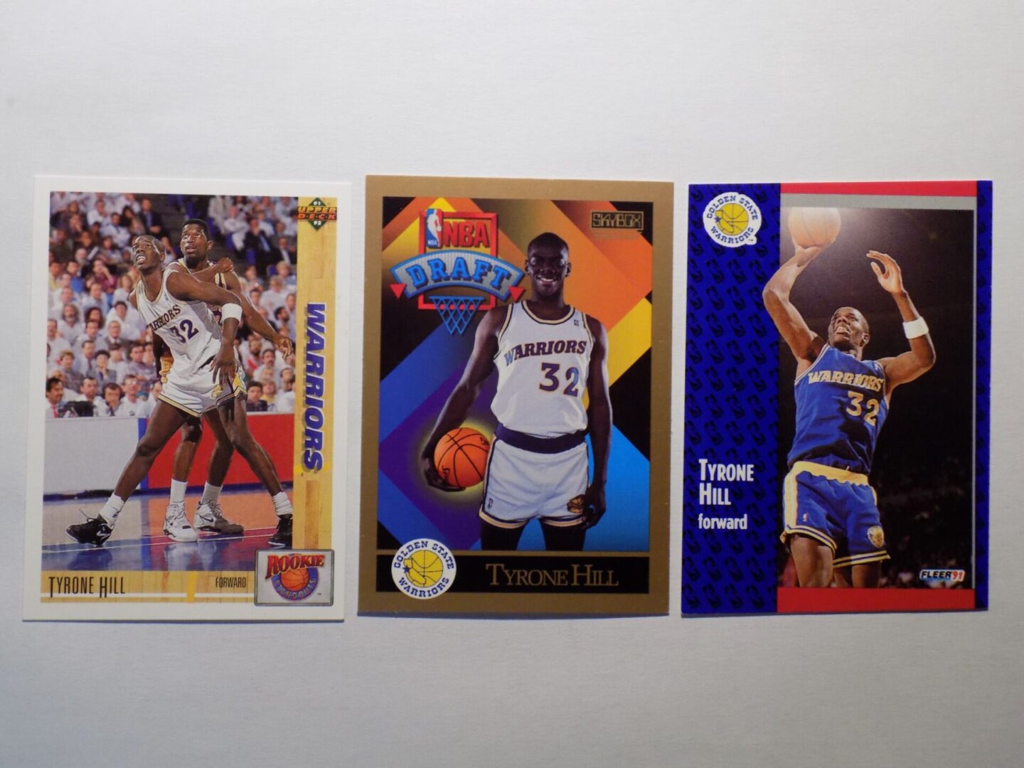 Three Hill, Tyrone basketball cards with different players on them.