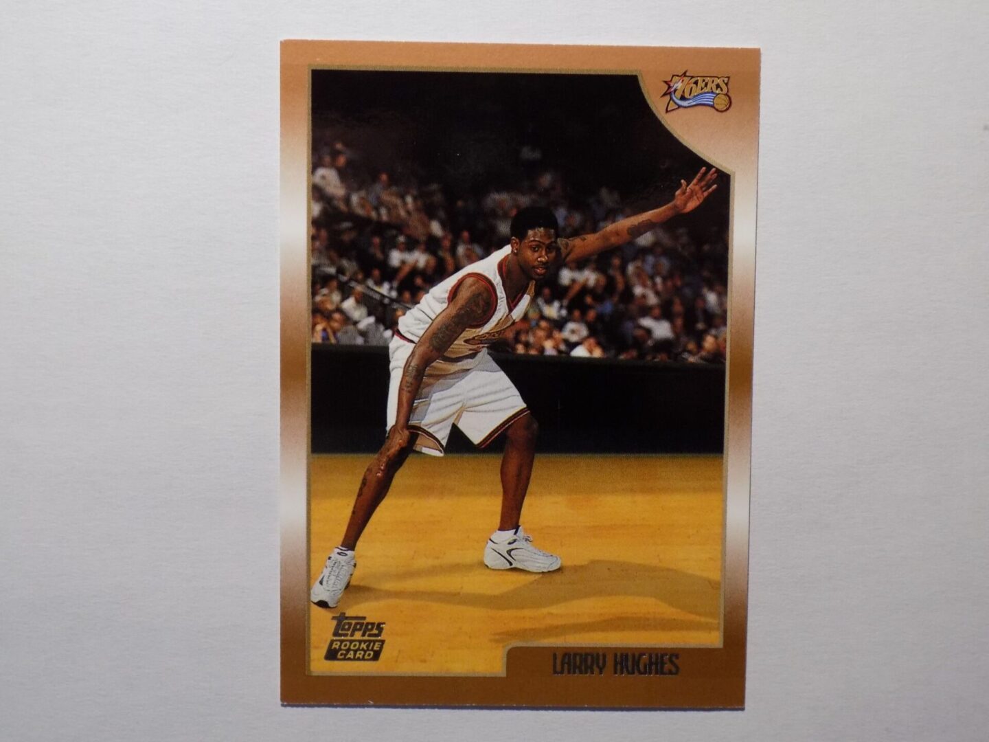 A Larry Hughes card with a basketball player on it.