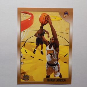 A Antawn Jamison basketball card with an image of a player dribbling.