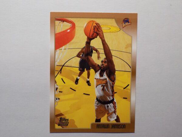 A Antawn Jamison basketball card with an image of a player dribbling.