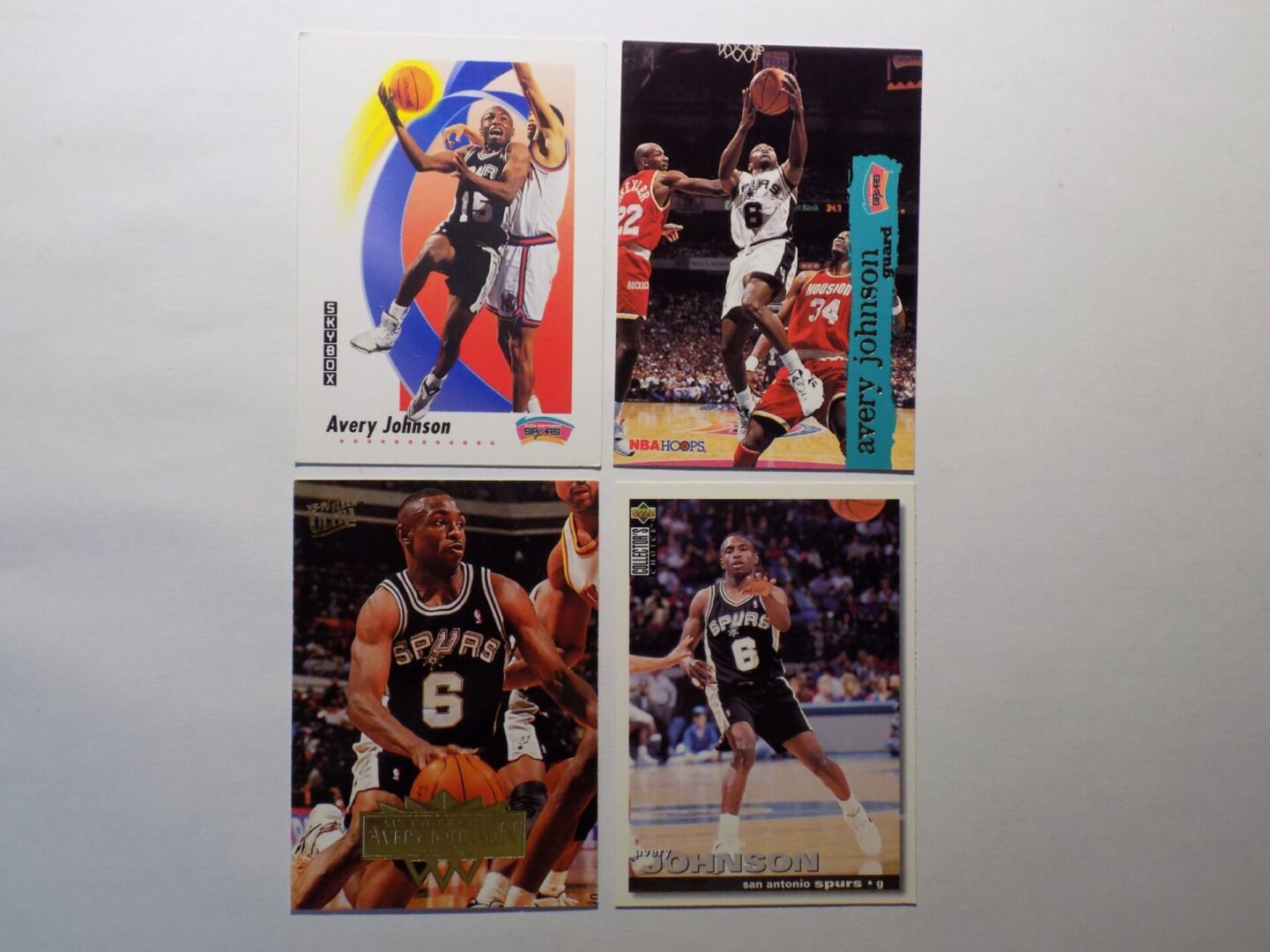 A group of Johnson, Avery basketball cards with different players on them.