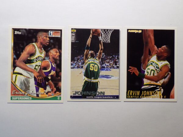 Three basketball cards with Johnson, Ervin on them.