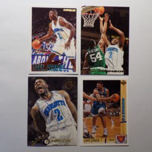 Four basketball cards with Johnson, Larry on them.