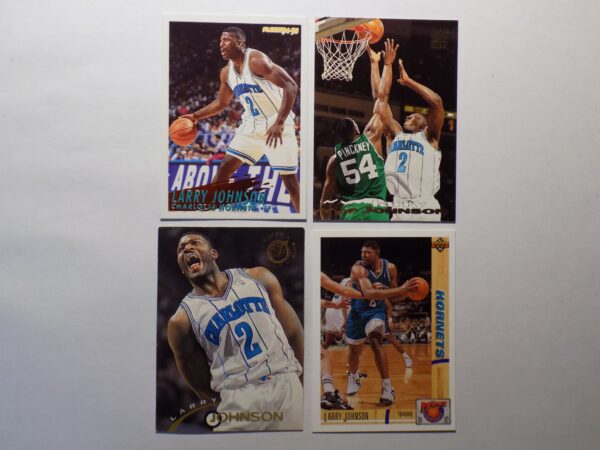 Four basketball cards with Johnson, Larry on them.