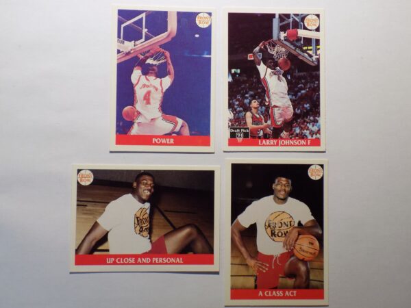 A set of four Johnson, Larry basketball cards with Johnson, Larry in the middle.