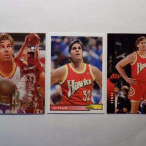 Three Koncak, Jon basketball cards with different players on them.