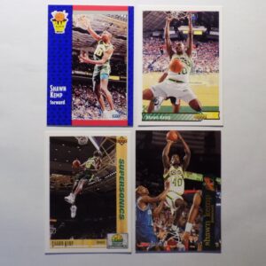 A set of Kemp, Shawn basketball cards with a player in the air.