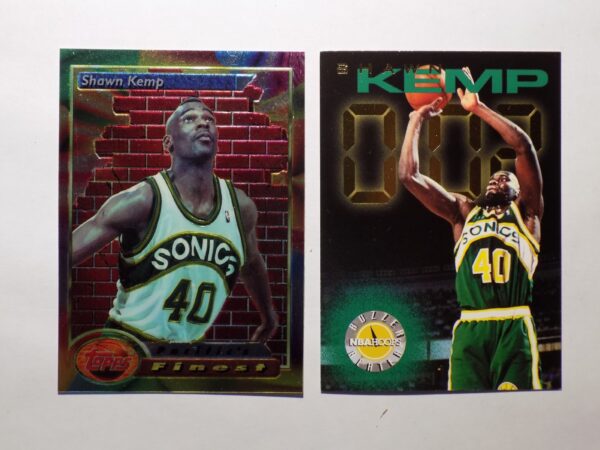 A pair of Kemp, Shawn basketball cards with two players on them.