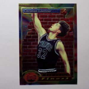 A Laettner, Christian card with a basketball player on it.