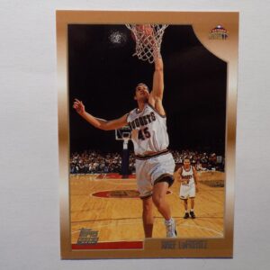 A LaFrentz, Raef card with a man dunking a basketball.