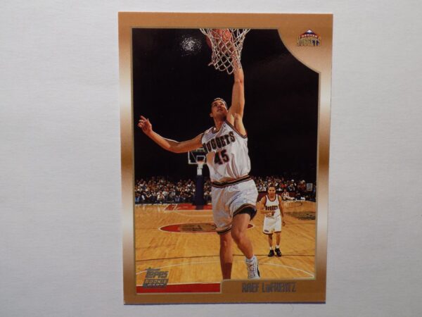 A LaFrentz, Raef card with a man dunking a basketball.