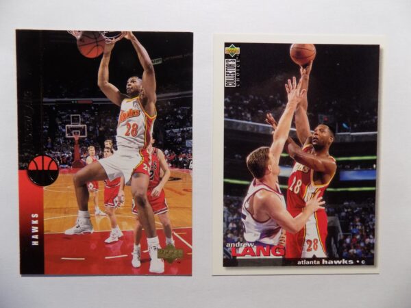 A pair of Lang, Andrew basketball cards with two players in action.