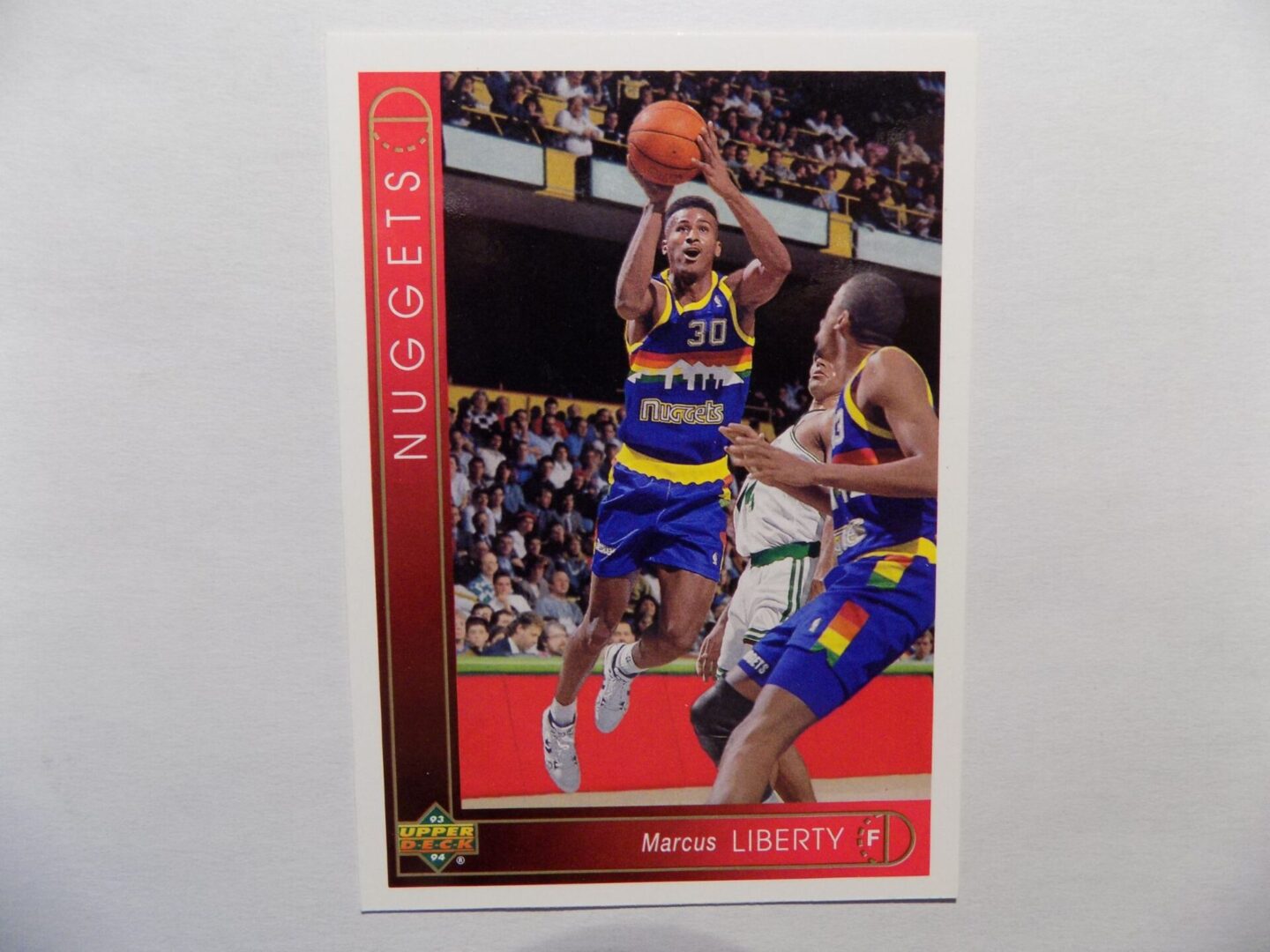 A Liberty and Marcus basketball card.