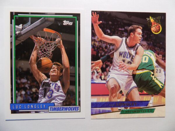 A pair of basketball cards with Luc Longley in the dunk.